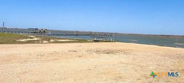 a view of yard with swimming pool and trees