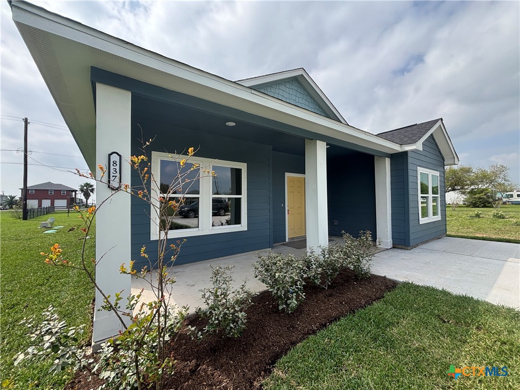 837 Swallow Drive Palacios, TX 77465 - Photo 4 of 35 a front view of a house with garden