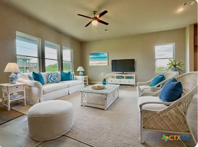a living room with furniture and a flat screen tv