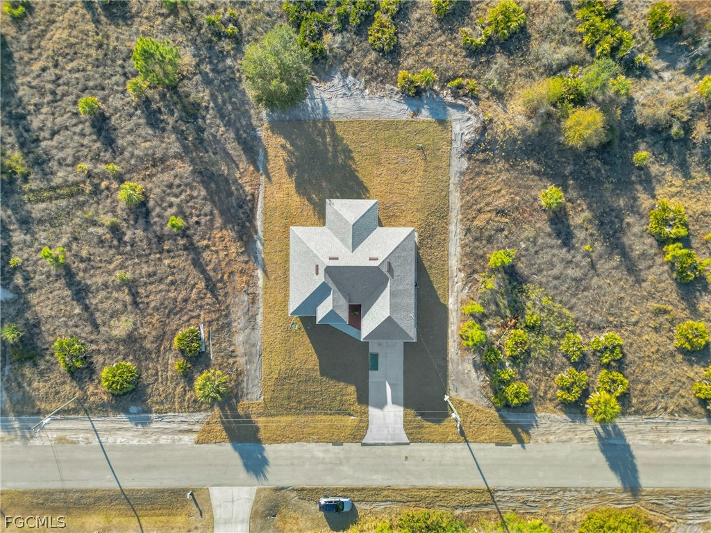 1819 Rush Avenue Lehigh Acres, FL 33972 - Photo 27 of 40 an aerial view of a house with garden space