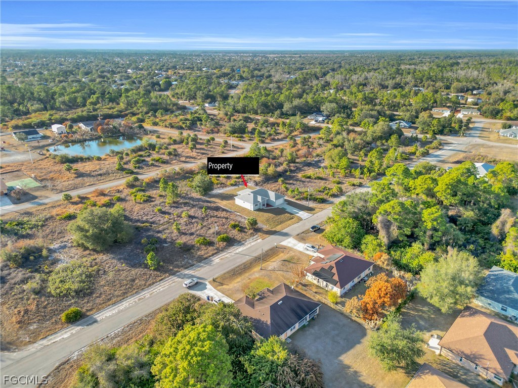1819 Rush Avenue Lehigh Acres, FL 33972 - Photo 36 of 40 an aerial view of residential houses with outdoor space