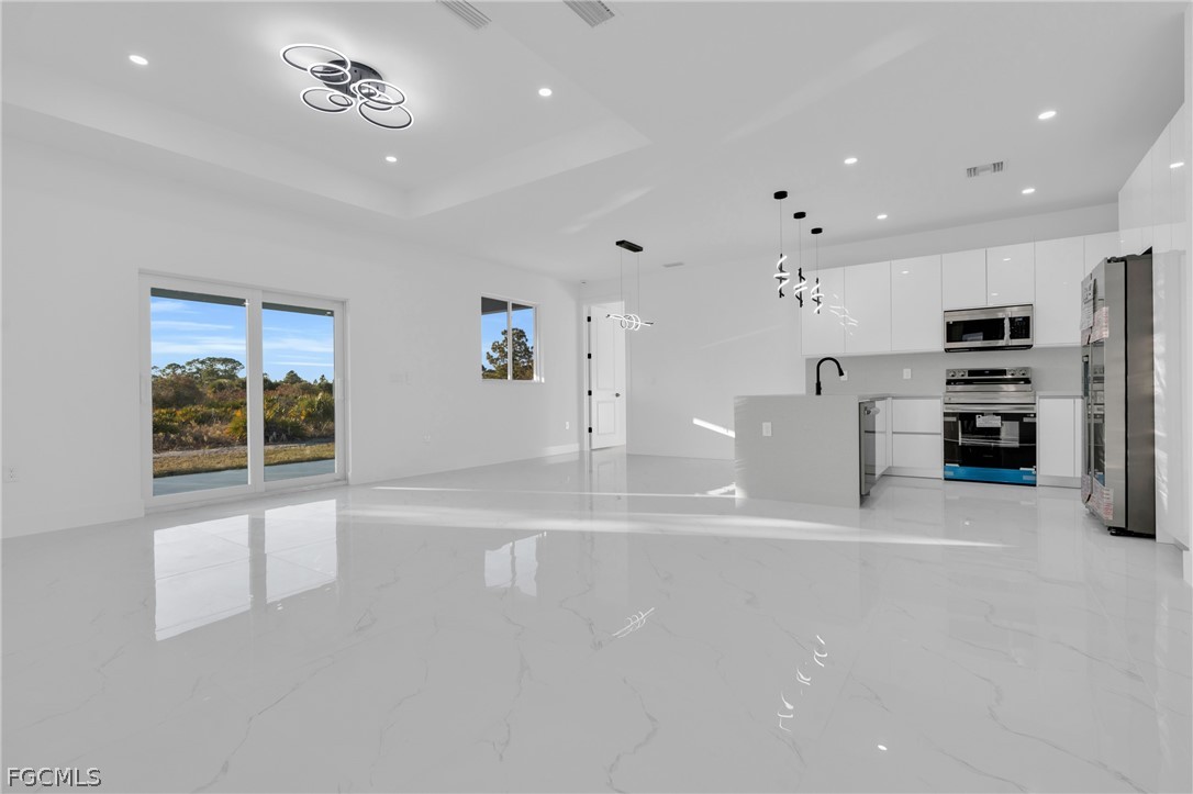 1819 Rush Avenue Lehigh Acres, FL 33972 - Photo 6 of 40 a view of kitchen and windows