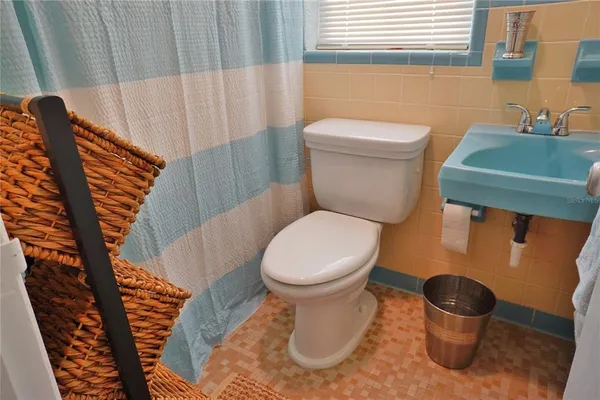 a bathroom with a toilet and a sink