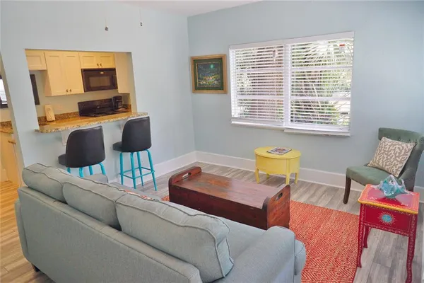 a living room with furniture and a window