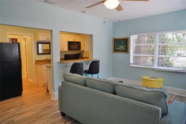 a living room with furniture and a window