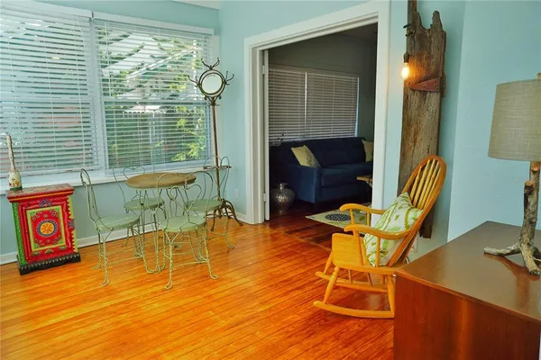 a view of a chairs and table in the patio