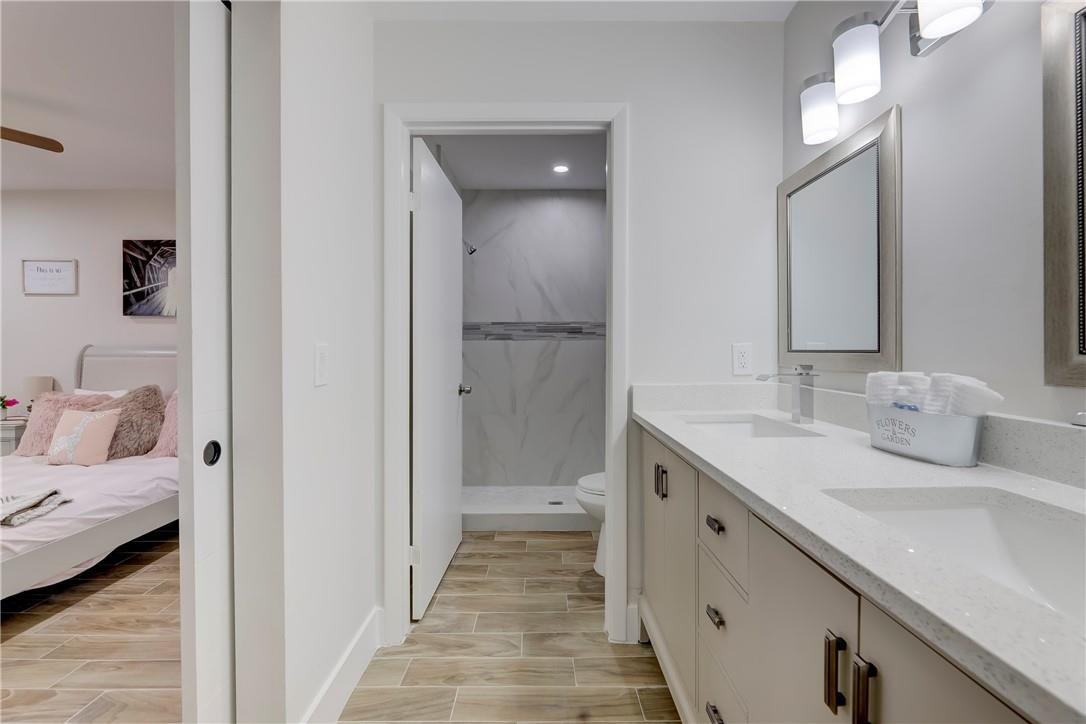 8577 Boca Glades Boulevard, Unit H Boca Raton, FL 33434 - Photo 18 of 34 a bathroom with a sink and a mirror