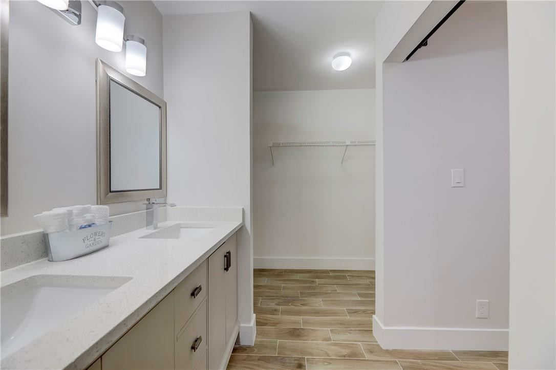 8577 Boca Glades Boulevard, Unit H Boca Raton, FL 33434 - Photo 20 of 34 a bathroom with a sink and a mirror