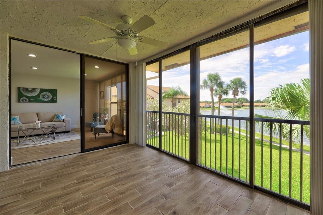 8577 Boca Glades Boulevard, Unit H Boca Raton, FL 33434 - Photo 27 of 34 a view of an entryway with a floor to ceiling window