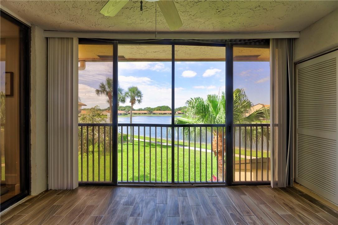 8577 Boca Glades Boulevard, Unit H Boca Raton, FL 33434 - Photo 28 of 34 a view of porch with a floor to ceiling window