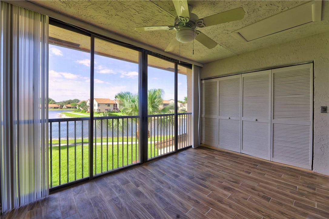 8577 Boca Glades Boulevard, Unit H Boca Raton, FL 33434 - Photo 29 of 34 a view of hallway with a large window