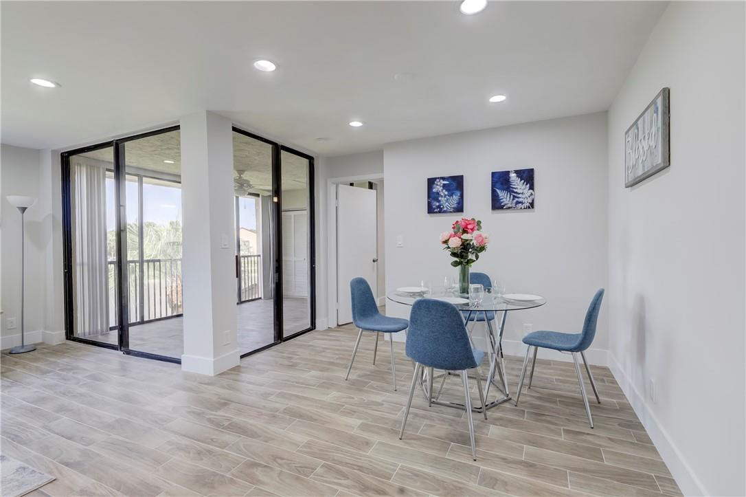 8577 Boca Glades Boulevard, Unit H Boca Raton, FL 33434 - Photo 6 of 34 a living room with furniture and a potted plant