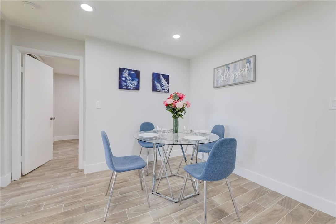 8577 Boca Glades Boulevard, Unit H Boca Raton, FL 33434 - Photo 7 of 34 a dining room with furniture and a potted plant