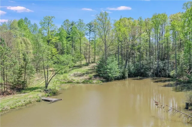 a view of a lake with a yard