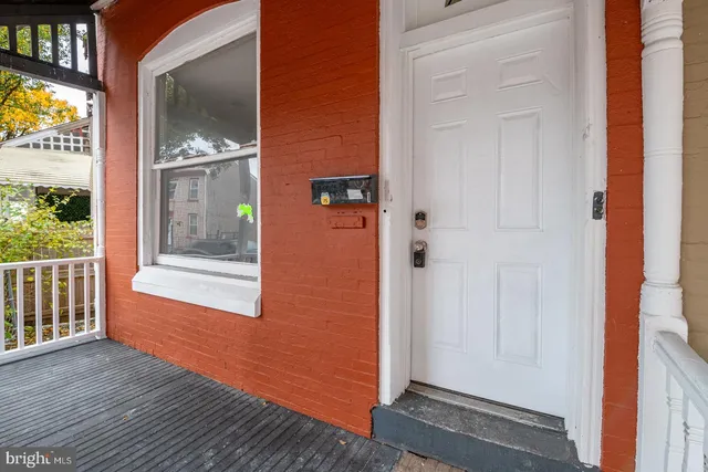 a view of front door with wooden floor