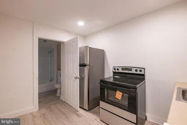 a kitchen with a stove and a microwave