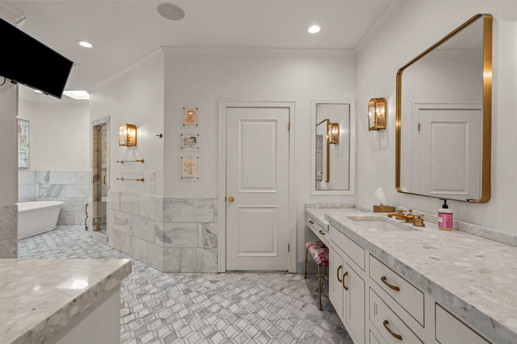 5849 Merrymount Road Westover Hills, TX 76107 - Photo 28 of 40 a spacious bathroom with a double vanity sink mirror and shower