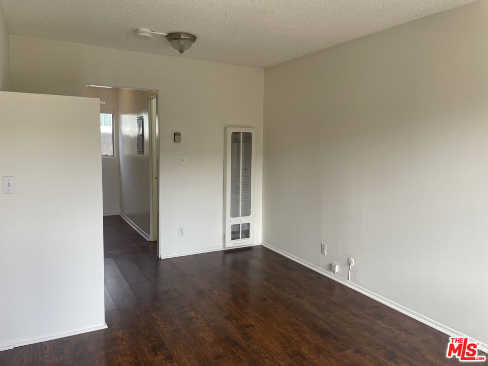1150 North Commonwealth Avenue, Unit 2 Los Angeles, CA 90029 - Photo 3 of 8 wooden floor in an empty room