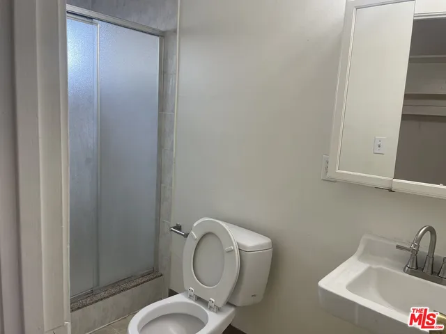 a bathroom with a toilet and a sink