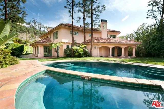 front view of house with a swimming pool