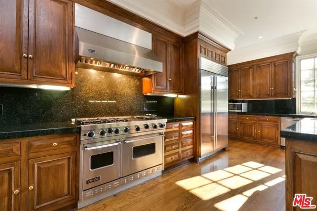 a kitchen with a stove and a cabinet
