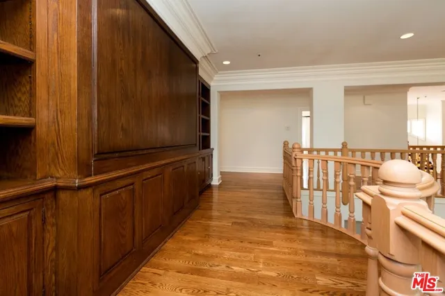 a view of wooden floor and windows in a room
