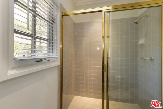 a view of balcony with wooden floor and seating space