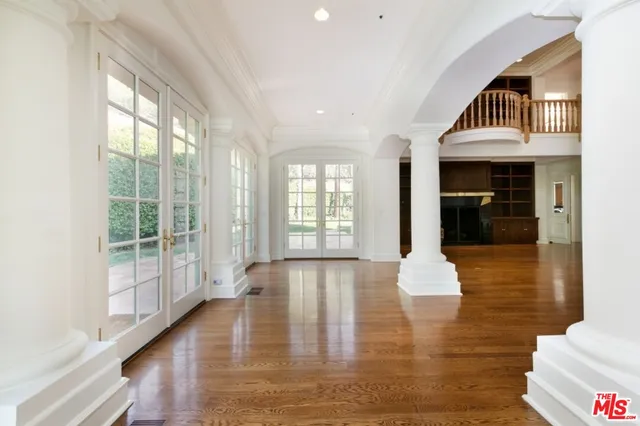 a view of an entryway with wooden floor