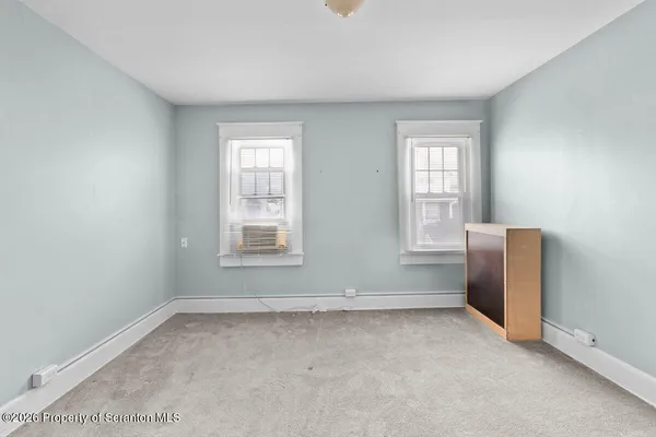 a view of a door and a window in a room