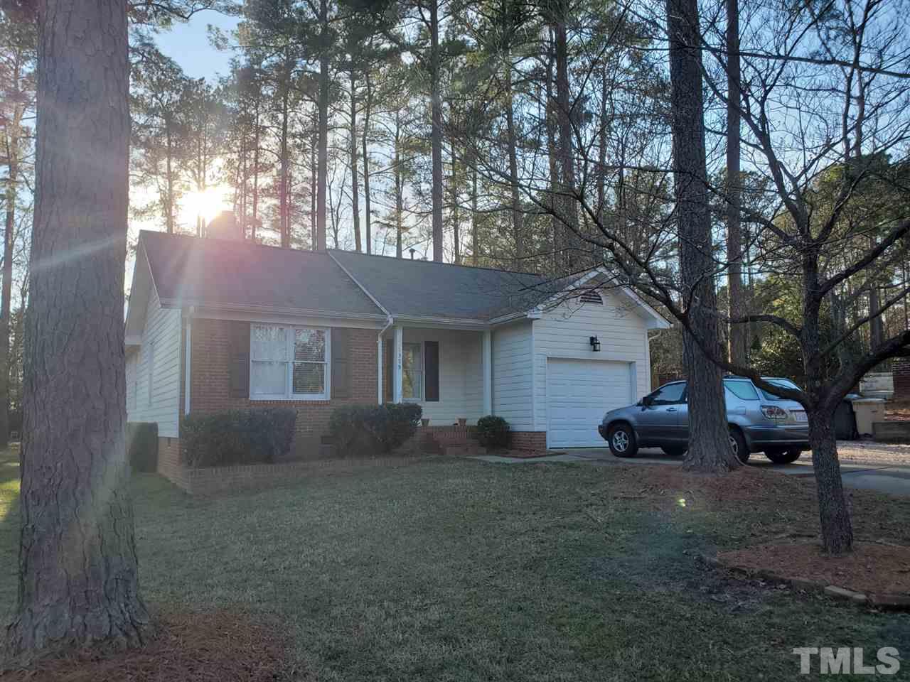 1309 Elkhorn Road Garner, NC 27529 - Photo 1 of 3 a front view of a house with garden