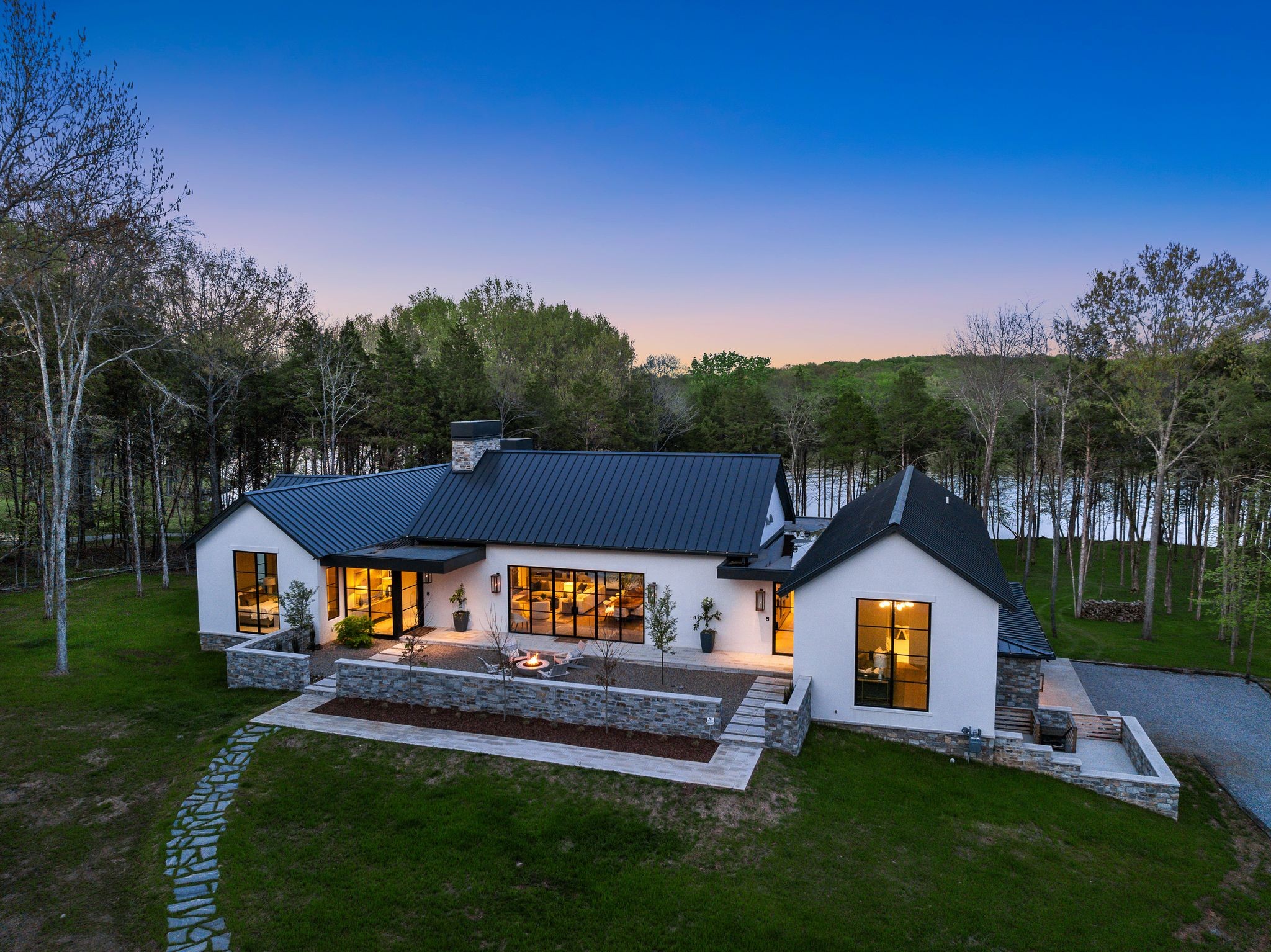 8520 Saundersville Road Mount Juliet, TN 37122 - Photo 66 of 70 a front view of a house with a yard table and chairs