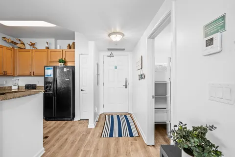 a kitchen with a refrigerator and a stove