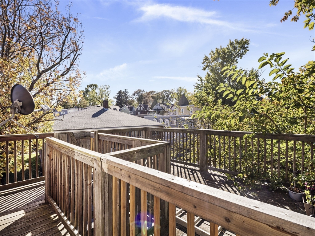 95 Florida Street, Unit 2 Boston, MA 02124 - Photo 19 of 29 a view of a balcony with wooden floor and fence