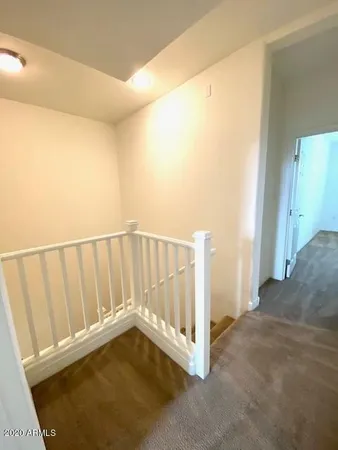 a view of a room with a wooden floor