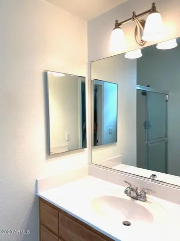 a bathroom with a sink and a mirror