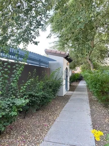a view of a pathway both side of garden