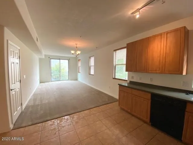 a view of livingroom with kitchen and window
