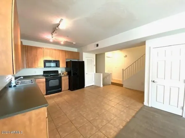 a view of a kitchen with a sink