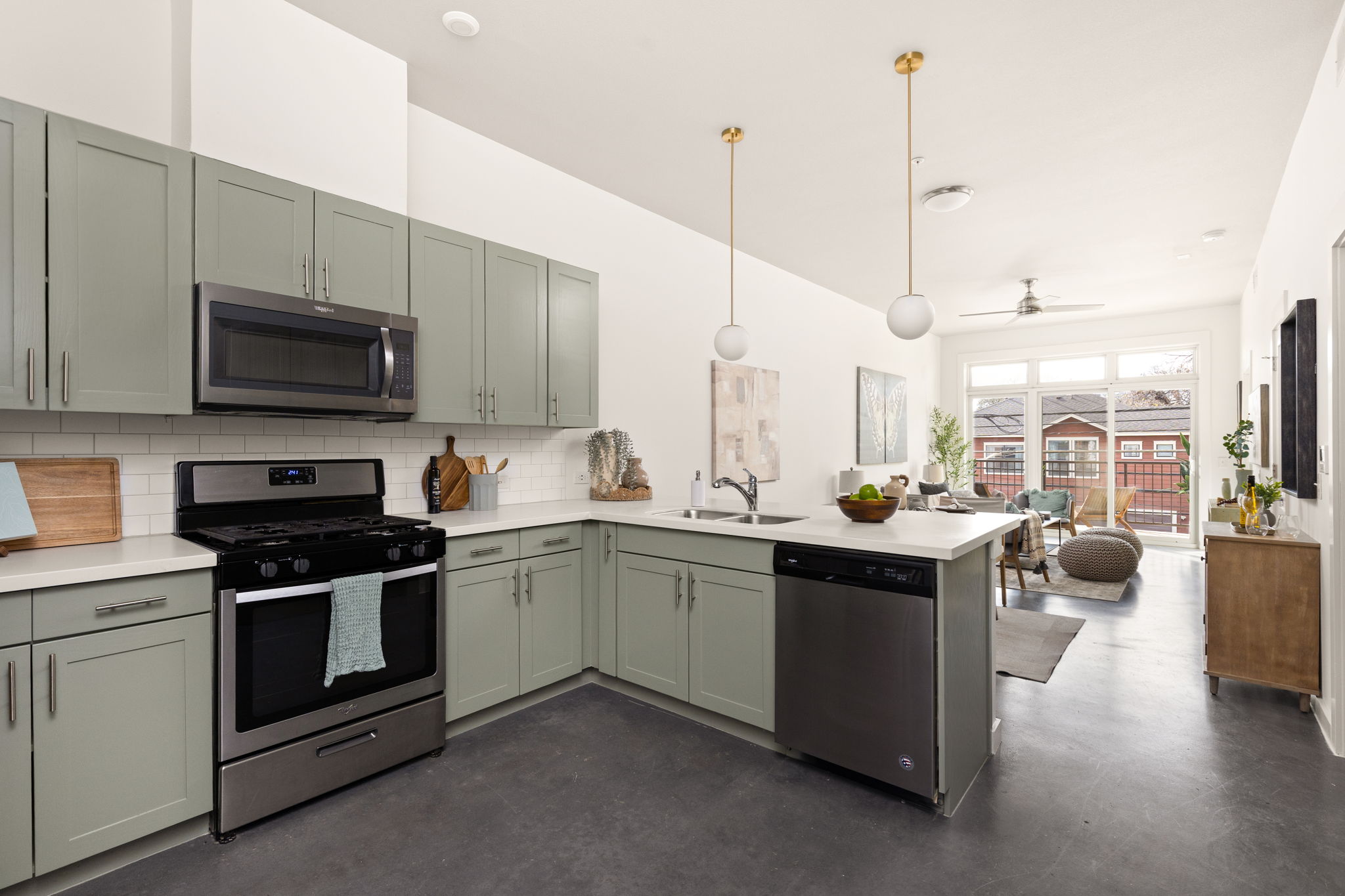 1301 Chicon Street, Unit 203 Austin, TX 78702 - Photo 27 of 27 a kitchen with stainless steel appliances granite countertop a stove top oven a sink dishwasher a dining table and chairs with wooden floor