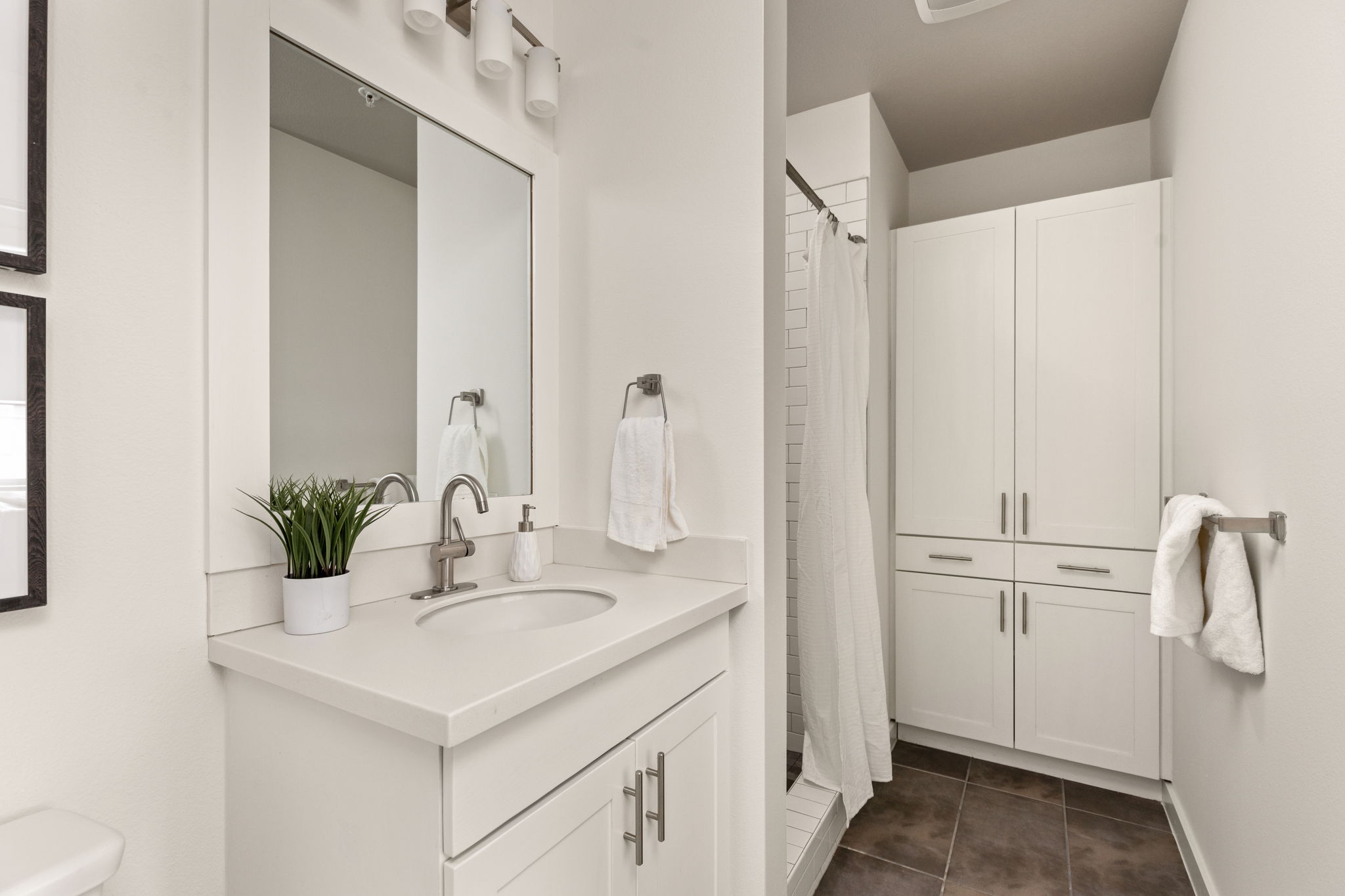 1301 Chicon Street, Unit 203 Austin, TX 78702 - Photo 12 of 27 a bathroom with a sink and a mirror