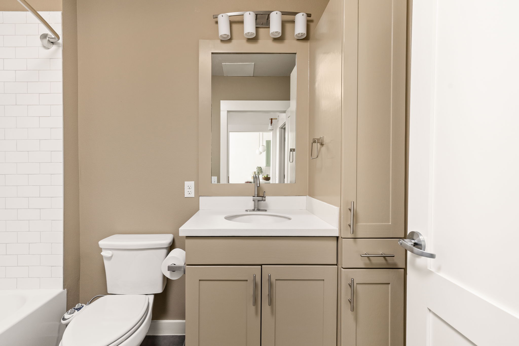 1301 Chicon Street, Unit 203 Austin, TX 78702 - Photo 15 of 27 a bathroom with a sink vanity mirror and toilet