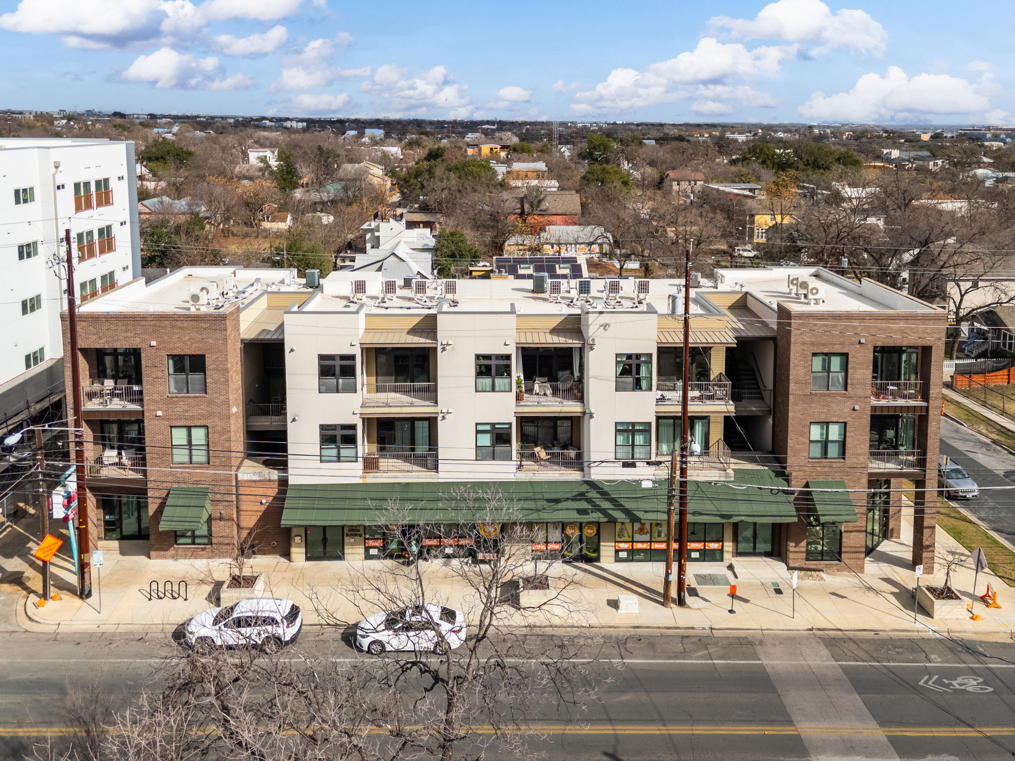 1301 Chicon Street, Unit 203 Austin, TX 78702 - Photo 25 of 27 a view of a brick building with many windows