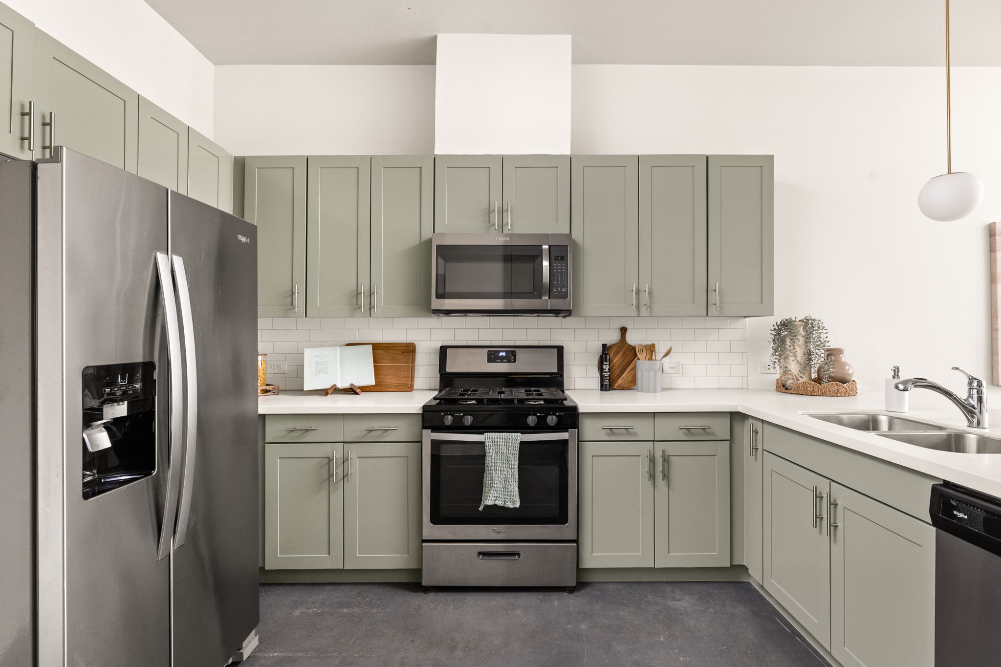 1301 Chicon Street, Unit 203 Austin, TX 78702 - Photo 4 of 27 a kitchen with a sink stove and refrigerator