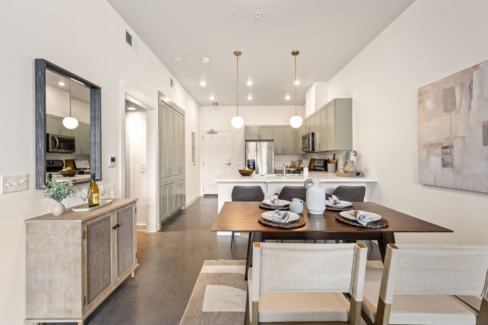 1301 Chicon Street, Unit 203 Austin, TX 78702 - Photo 7 of 27 a large kitchen with a table and chairs