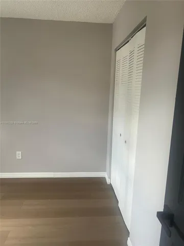 a bathroom with a toilet and a bath tub