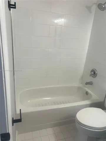 a bathroom with a sink toilet and mirror