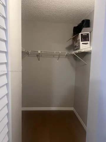 an empty room with wooden floor