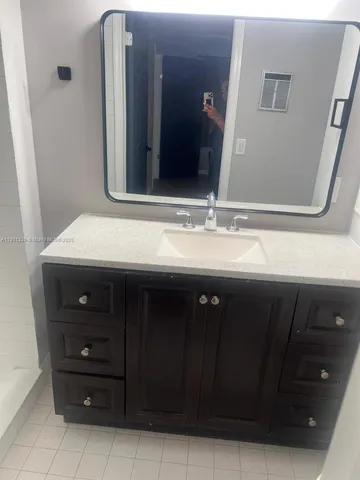 a bathroom with a shower and toilet