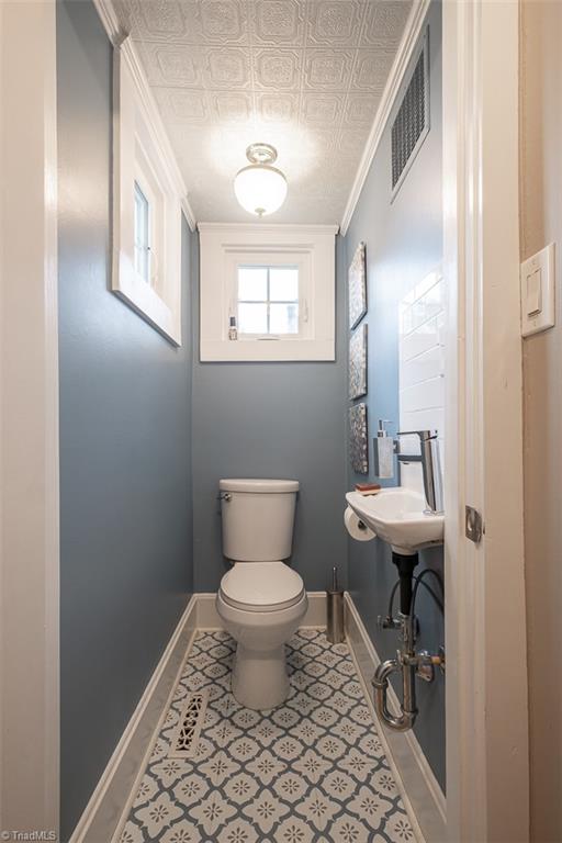 113 Gwyn Avenue Elkin, NC 28621 - Photo 16 of 39 Powder room located on main level.