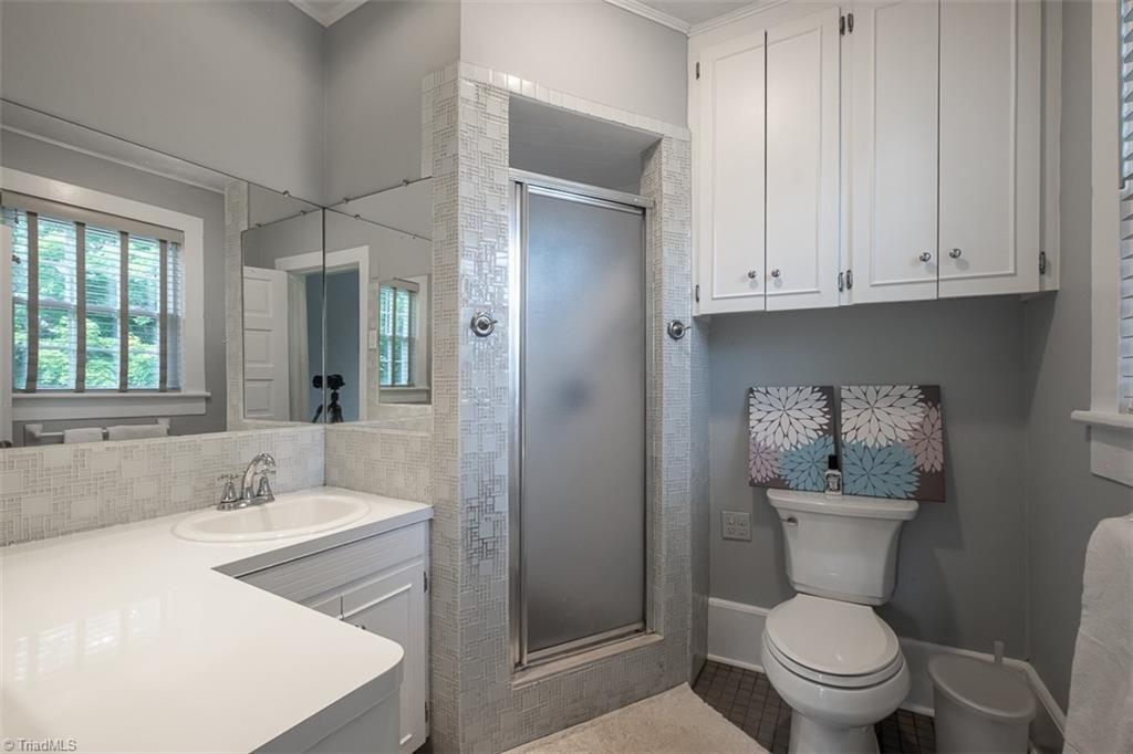 113 Gwyn Avenue Elkin, NC 28621 - Photo 22 of 39 Primary bedroom en-suite full bathroom with walk-in shower.